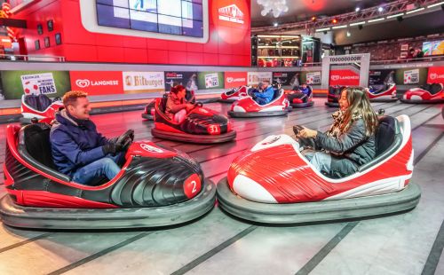 Several guests in the bumper cars at the Arena of Football in Europa-Park.