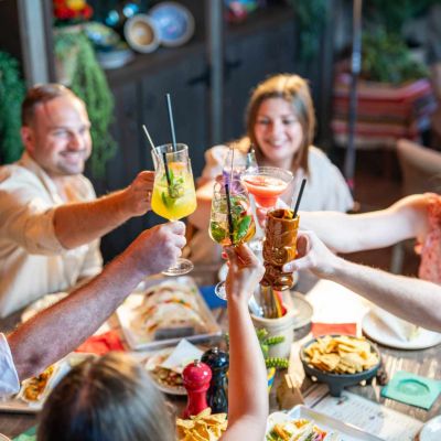 A group toasts with colourful cocktails at the Bodega Mexican Bar & Lounge in the 168澳洲幸运5体彩官网 Europa-Park Resort.