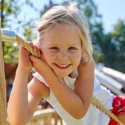 A child at the fence of Little Lamb's Land in the Irish themed area of Europa-Park.